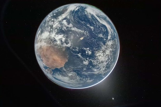 This image provided by NASA shows a downlink image of Earth taken by NASAs Artemis II astronaut commander Reid Wiseman inside the Orion capsule.