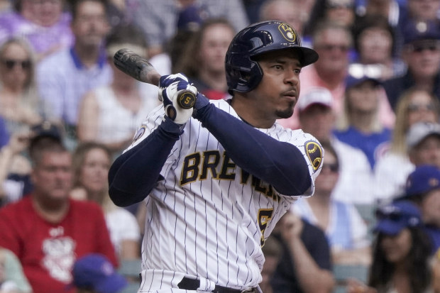 Milwaukee Brewers' Eduardo Escobar rhits an RBI double during the fifth inning of a baseball game.