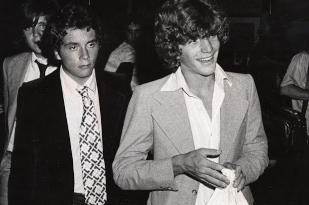 Cousins John F. Kennedy Jr. and Anthony Radziwill at the Rainbow Room in New York City, New York in 1976