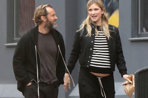 Jude Law and a clearly pregnant wife Phillipa Coan in London in June 2020.