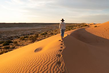 Walk across sand dunes