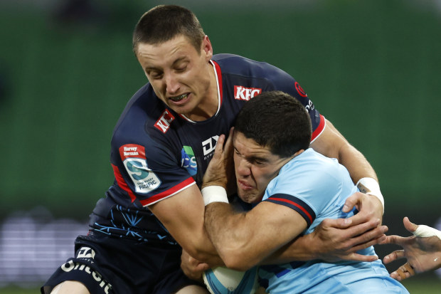 Nick Jooste of the Rebels tackles Ben Donaldson of the Waratahs.