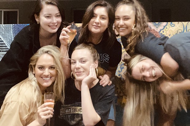 Danielle Smyrneos (top centre) and Nicole Costa (bottom centre) with a group of friends.