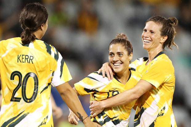 Katrina Gorry of the Matildas celebrates with her teammates Sam Kerr and Elise Kellond-Knight of the Matildas after scoring a goal during the Women's Olympic Football Tournament Qualifier match in 2020.