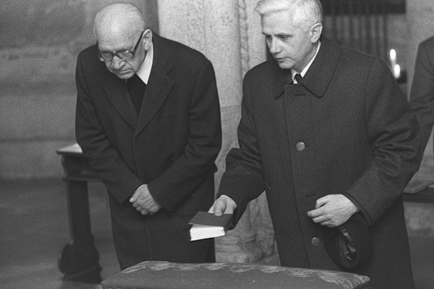 Newly nominated Archbishop of Munich and Freising, Joseph Ratzinger, right, prays with Bishop Erns Tewes in the Crypta of the Cathedral of Freising, southern Germany on March 31, 1977. 