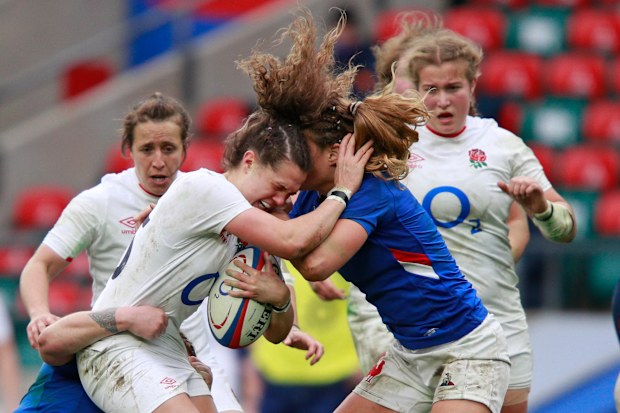 England's Ellie Kildunne is tackled by Marjorie Mayans of France.
