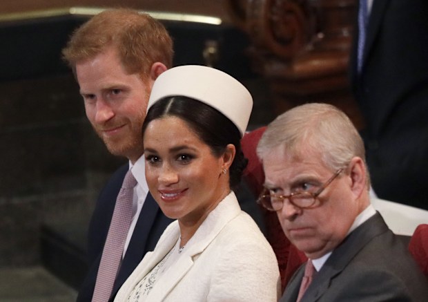 Meghan, Duchess of Sussex sits with Prince Harry and Prince Andrew during the Commonwealth Service at Westminster Abbey in London, Monday, March 11, 2019. 