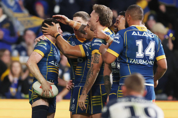 SYDNEY, AUSTRALIA - MAY 26: Mitchell Moses of the Eels celebrates scoring a try with team mates during the round 13 NRL match between Parramatta Eels and North Queensland Cowboys at CommBank Stadium on May 26, 2023 in Sydney, Australia. (Photo by Mark Metcalfe/Getty Images)