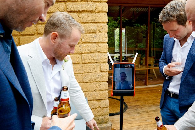 Matty enjoying a beer with James and other guests.