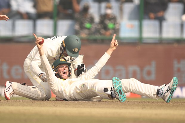 Peter Handscomb of Australia celebrates taking a catch to dismiss Shreyas Iyer of India.