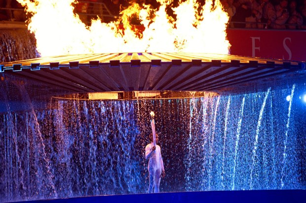 Cathy Freeman lighting the cauldron that would burn throughout the Sydney 2000 Olympics.