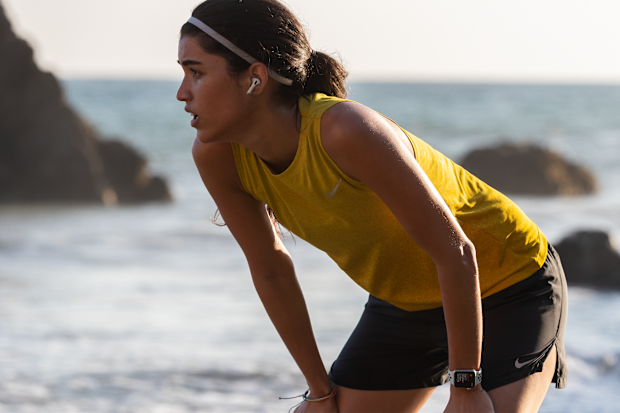 Woman wearing AirPod Pros