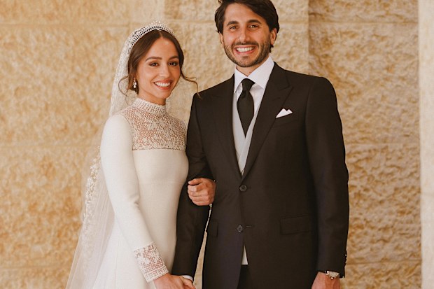 princess iman engagement dress For Jordan's Princess Iman, @MariaGraziaChiuri incorporated delicate floral  details into the collar and sleeves of her sleek wedding dress.  Contemporary yet timeless, the white gown is adorned with immaculate lace  work and
