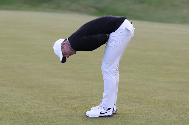 Rory McIlroy of Northern Ireland reacts to a missed putt on the 18th green.