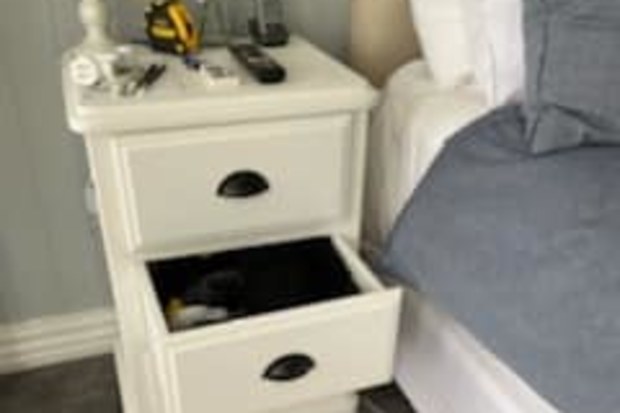The homeowner had reached into his drawer for a pair of socks, but instead grabbed something "wriggling and leathery".