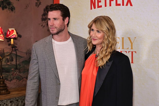 Liam Hemsworth (left) and Laura Dern pictured at a screening of "Lonely Planet" in New York City on October 1.