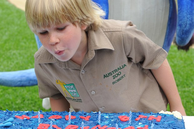 BEERWAH, AUSTRALIA - DECEMBER 1: In this handout photo provided by Australia Zoo, Robert Irwin blows out the candles on his cake as he celebrates his eighth birthday, at Australia Zoo, on December 1, 2011 in Beerwah, Australia. (Photo by Australia Zoo via Getty Images)