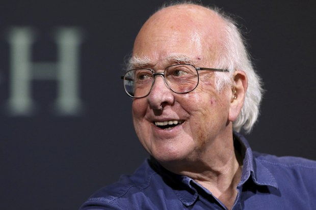 Britain's Professor Peter Higgs smiles during a press conference in Edinburgh, Scotland, on October 11, 2013.  