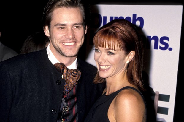 Jim Carrey and Lauren Holly at the Hollywood premiere of Dumb and Dumber in December 1994.