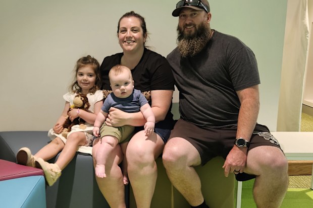 Izzy with her mum Amy, dad Matt, and little brother William.