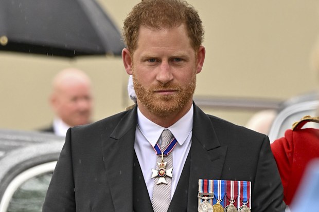 Prince Harry arrives for the coronation of King Charles at Westminster Abbey, London