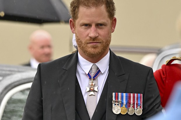 Prince Harry arrives for the coronation of King Charles at Westminster Abbey, London