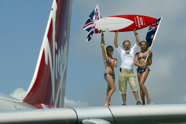 Happier days: Sir Richard Branson, Chairman of Virgin Atlantic Airways pictured arriving at Sydney International Airport with the first Virgin Atlantic flight to Australia, in 2004.