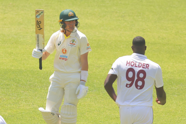 Marnus Labuschagne of Australia raises the bat for his 50 runs against West Indies in Perth. (Photo by James Worsfold/Getty Images)