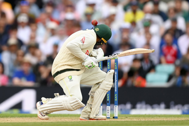 Usman Khawaja of Australia is hit on the helmet by a Mark Wood of England delivery during Day Four of the LV= Insurance Ashes 5th Test Match between England and Australia at The Kia Oval on July 30, 2023 in London, England. (Photo by Gareth Copley/Getty Images)