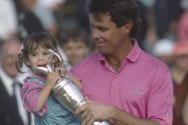 Ian Baker-Finch of Australia holds his daughter and the Claret Jug following his victory during The 120th Open Championship held at Royal Birkdale Golf Club from July 18-21,1991 in Southport, England. (Photo by R&A via Getty Images)
