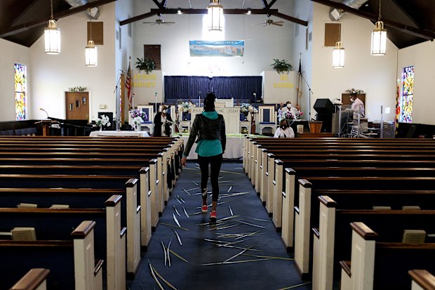 US churches hold Palm Sunday services despite state bans on gatherings