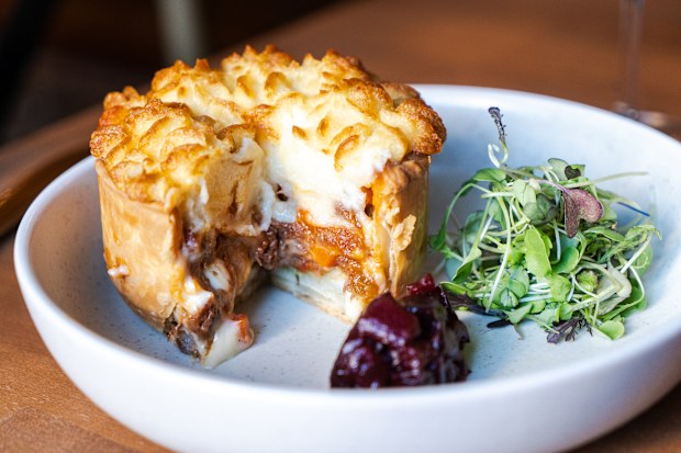 Peasant: The Urban Shepherd – Layers of sliced potato, slow-cooked lamb, cheese fondue, potato puree and goat cheese baked in a shortcrust pastry. 
