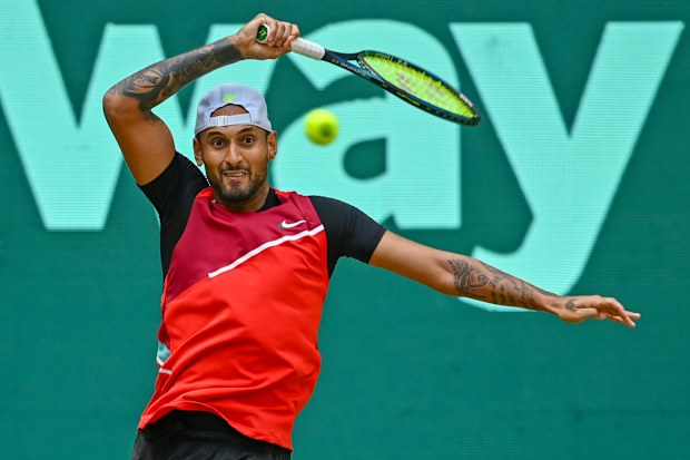 Nick Kyrgios plays a forehand in his match against Pablo Carreno Busta.
