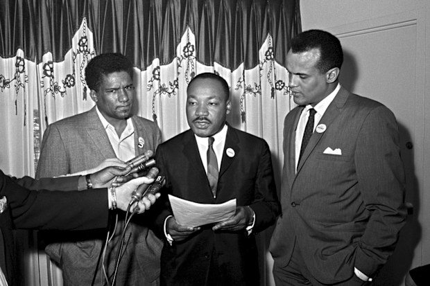 James Foreman, executive secretary of the Student Non-violent Coordinating Committee, left, Civil Rights leader Dr. Martin Luther King Jr., center, head of the Southern Christian Leadership Conference and activist-singer Harry Belafonte appear during a press conference in Atlanta on April 30, 1965