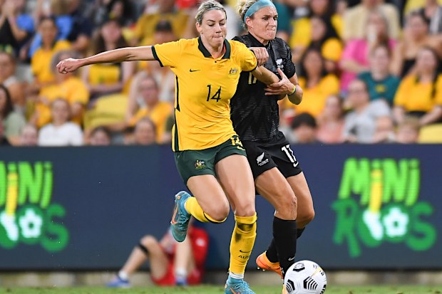 Matildas star Alanna Kennedy competes for the ball with New Zealand's Hannah Wilkinson during a match in April, 2022.