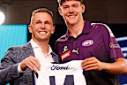 MELBOURNE, AUSTRALIA - NOVEMBER 20: Connor O'Sullivan is seen with Joel Selwood after being selected at number 11 by the Geelong Cats during the 2023 AFL Draft at Marvel Stadium on November 20, 2023 in Melbourne, Australia. (Photo by Michael Willson/AFL Photos via Getty Images)