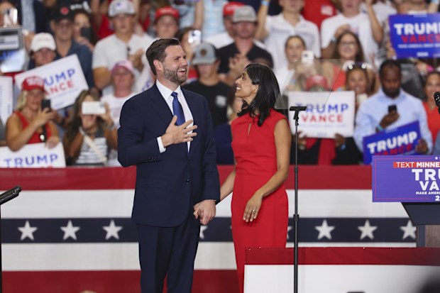 Republican vice presidential candidate Sen. JD Vance, R-Ohio, and his wife Usha Vance arrive to speak at a campaign rally, Saturday, July 27, 2024, in St. Cloud, Minn.  (AP Photo/Adam Bettcher)