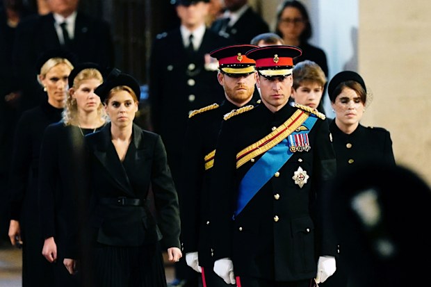 L-R: Zara Tindall, Lady Louise, Princess Beatrice, Prince William, the prince of Wales, Prince Harry, Princess Eugenie, Viscount James Severn and Peter Phillips attend the vigil of the Queen's grandchildren around the coffin, as it lies in state on the catafalque in Westminster Hall, at the Palace of Westminster, London, Saturday,  Sept. 17, 2022 