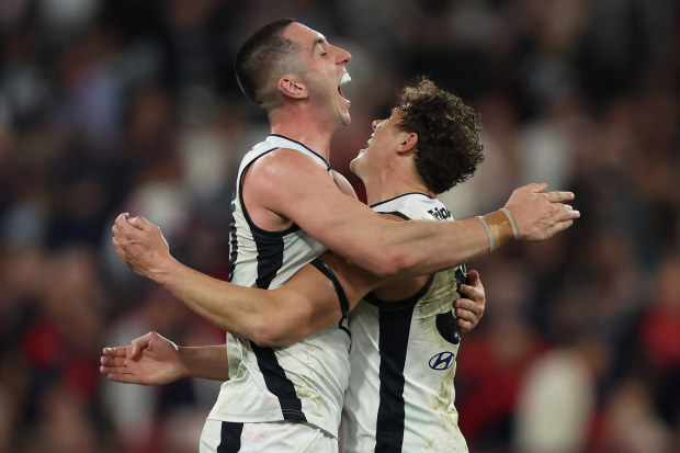 MELBOURNE, AUSTRALIA - SEPTEMBER 15: Jacob Weitering and Charlie Curnow of the Blues celebrate after the Blues defeated the Demons during the AFL First Semi Final match between Melbourne Demons and Carlton Blues at Melbourne Cricket Ground, on September 15, 2023, in Melbourne, Australia. (Photo by Robert Cianflone/Getty Images)