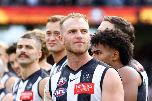 MELBOURNE, AUSTRALIA - APRIL 25: Tom Mitchell of the Magpies looks on during the Anzac Day observance ceremony during the 2023 AFL Round 06 match between the Collingwood Magpies and the Essendon Bombers at the Melbourne Cricket Ground on April 25, 2023 in Melbourne, Australia. (Photo by Dylan Burns/AFL Photos)
