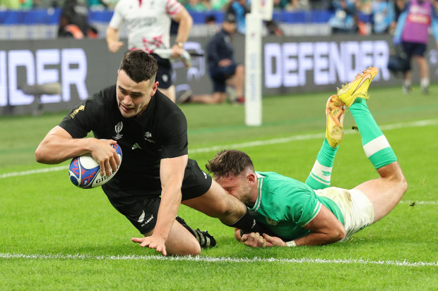 Will Jordan scores his team's third try during the Rugby World Cup match between Ireland and New Zealand at Stade de France.
