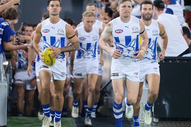 Jack Ziebell of the Kangaroos leads the team out.