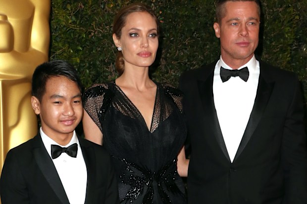 Maddox Jolie-Pitt with parents Angelina Jolie and Brad PItt at the Academy of Motion Picture Arts and Sciences' Governors Awards in November 2013.