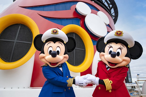 Mikey and Minnie stand on board the ship's main deck