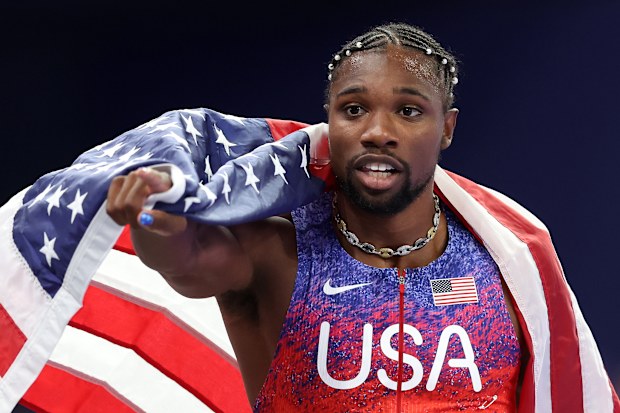 Noah Lyles celebrates winning the men's 100 metres at the Paris 2024 Olympics.