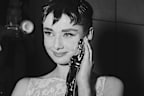 Audrey Hepburn holding the Academy Award for best actress in Roman Holiday, her first American film.