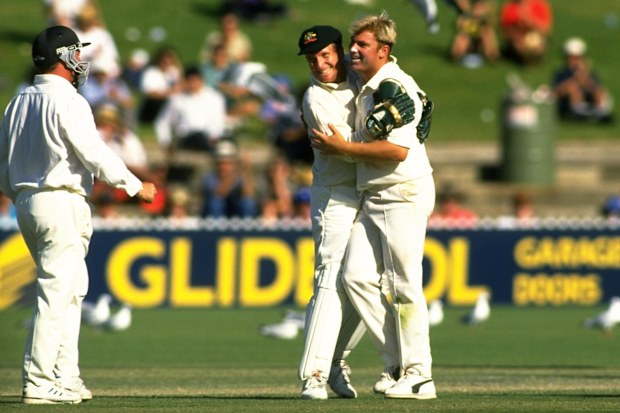 Ian Healy embraces Shane Warne after his 100th Test wicket, taken against South Africa at Adelaide Oval in the 1993-94.