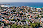Panoramic aerial drone view of the beachside suburbs of Bronte, Tamarama and Bondi, looking in the east direction in Sydney, NSW on a sunny morning - stock photo