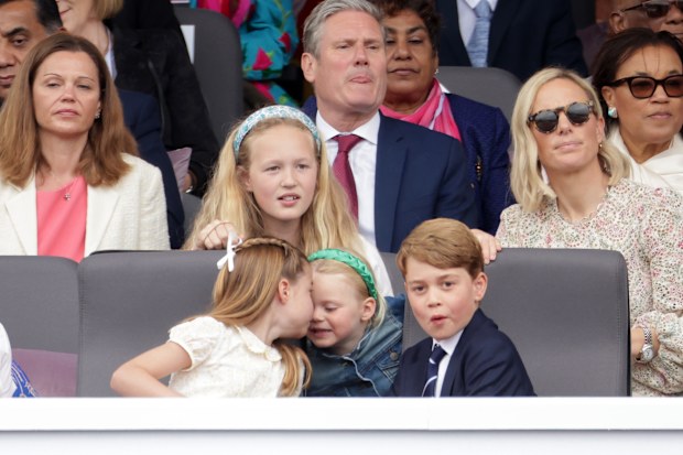 Princess Charlotte gives Lena Tindall a sweet peck on the nose.