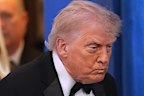 President Donald Trump with first lady Melania Trump, walks in to speak in the James Brady Press Briefing Room at the White House after an unspecified threat at the annual White House Correspondents' Association Dinner in Washington, Saturday, April 25, 2026.